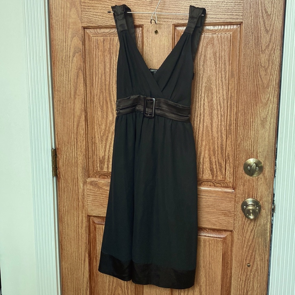 Black cocktail dress with satin details
